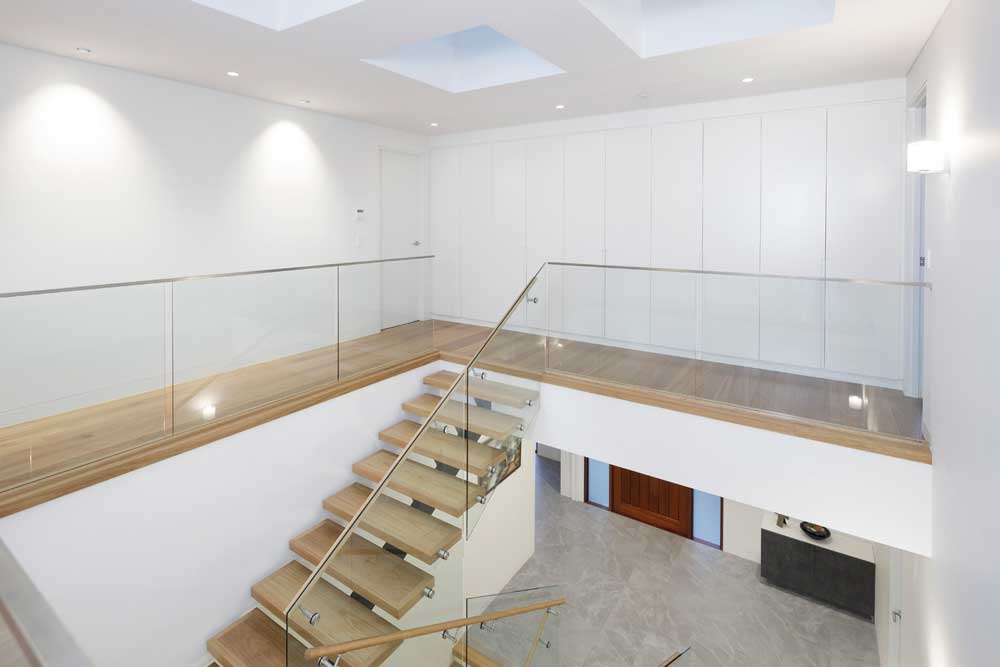 Natural Light Flooding The Steel-Spine Staircase