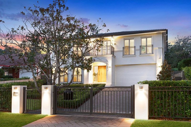 Street view of a modern home at dusk