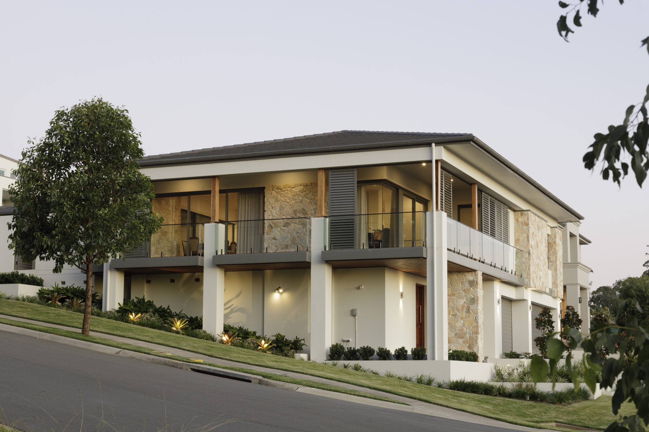 Castle Hill Mid-Century Contemporary: house against the slope of its natural terrain