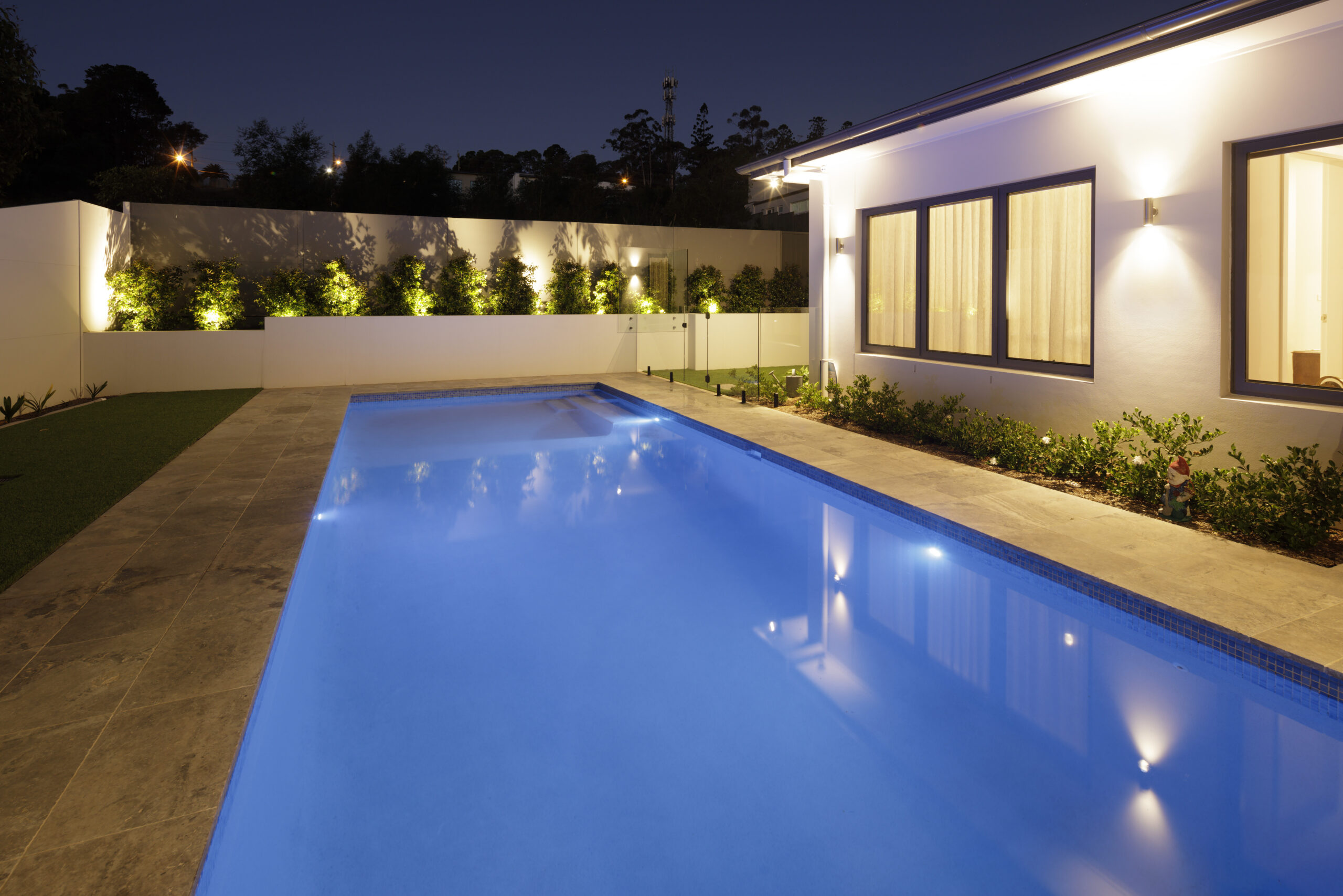 Castle Hill Mid-Century Contemporary: pool lit up at night