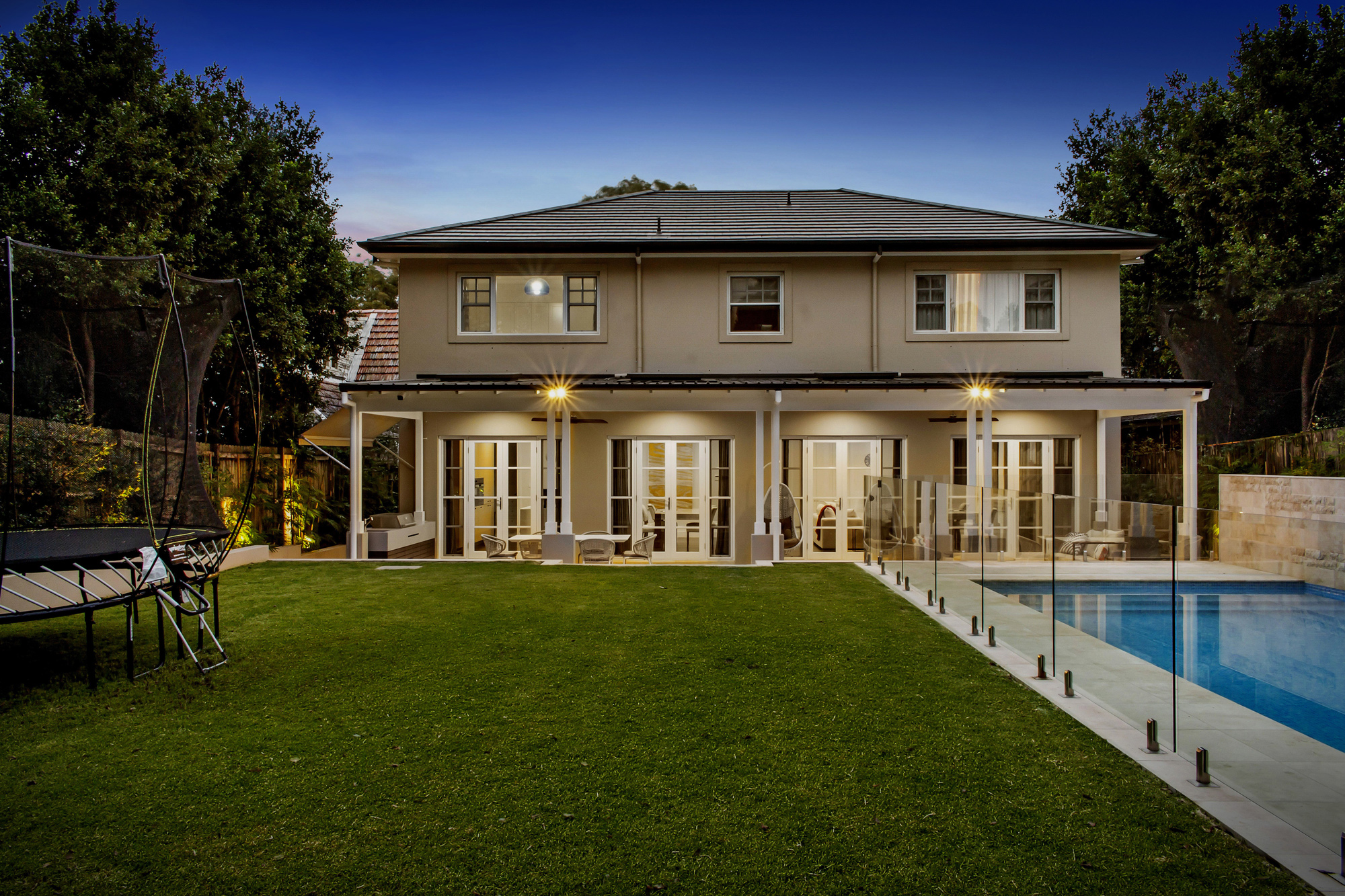 East Lindfield view from backyard of pool and house at dusk