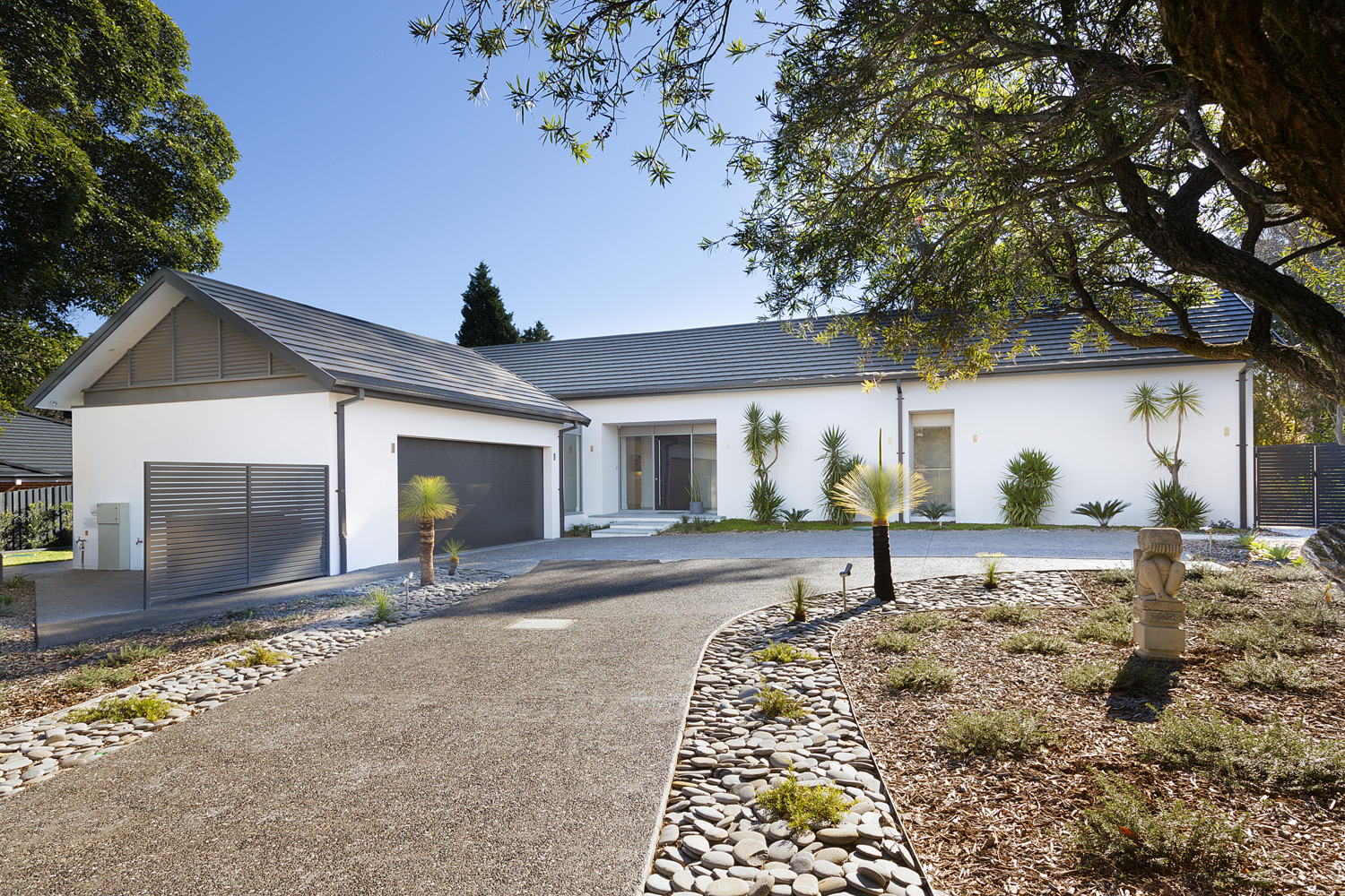 St Ives Contemporary Ranch: Winding driveway up to single storey home