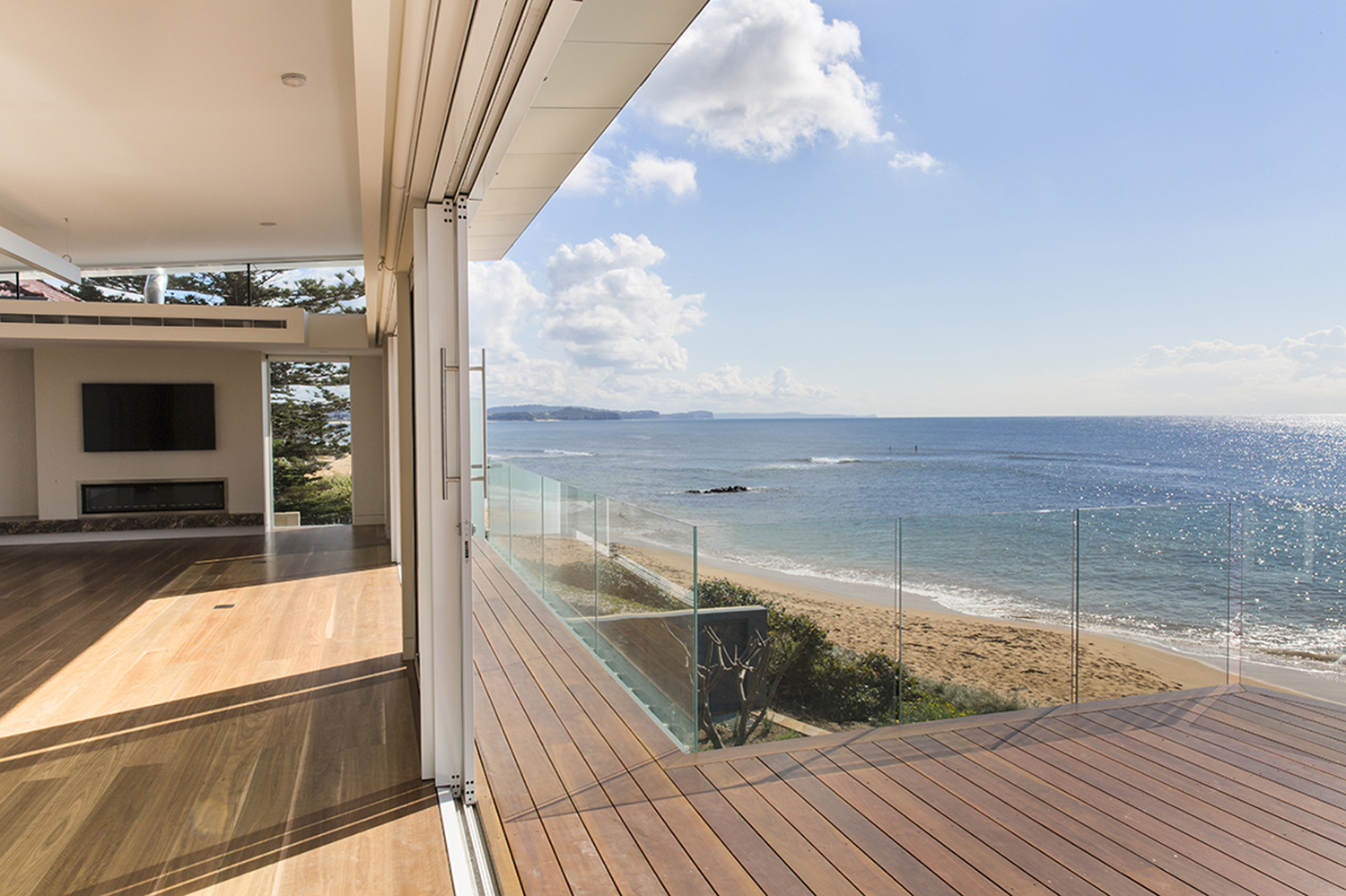 Collaroy Modern Beach: View of timber balcony directly onto the beach