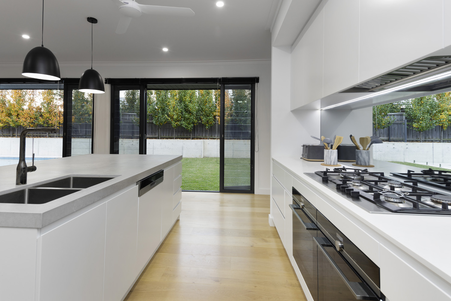 Glenhaven Contemporary Industrial: kitchen looking out onto backyard