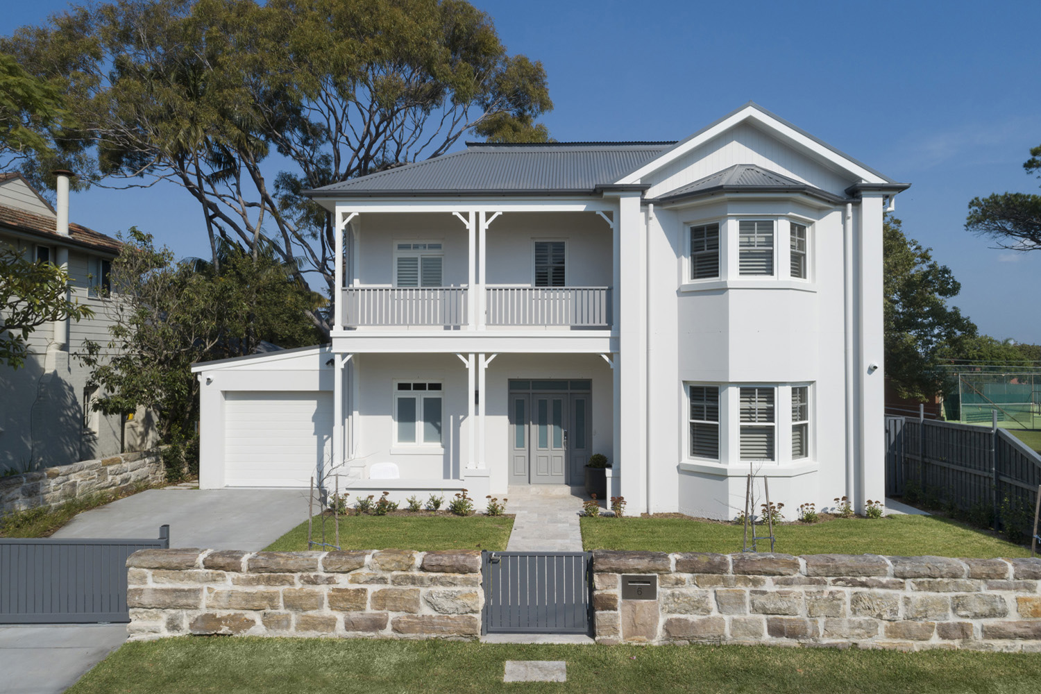 Greenwich Traditional Hamptons: Front facade with stone gate