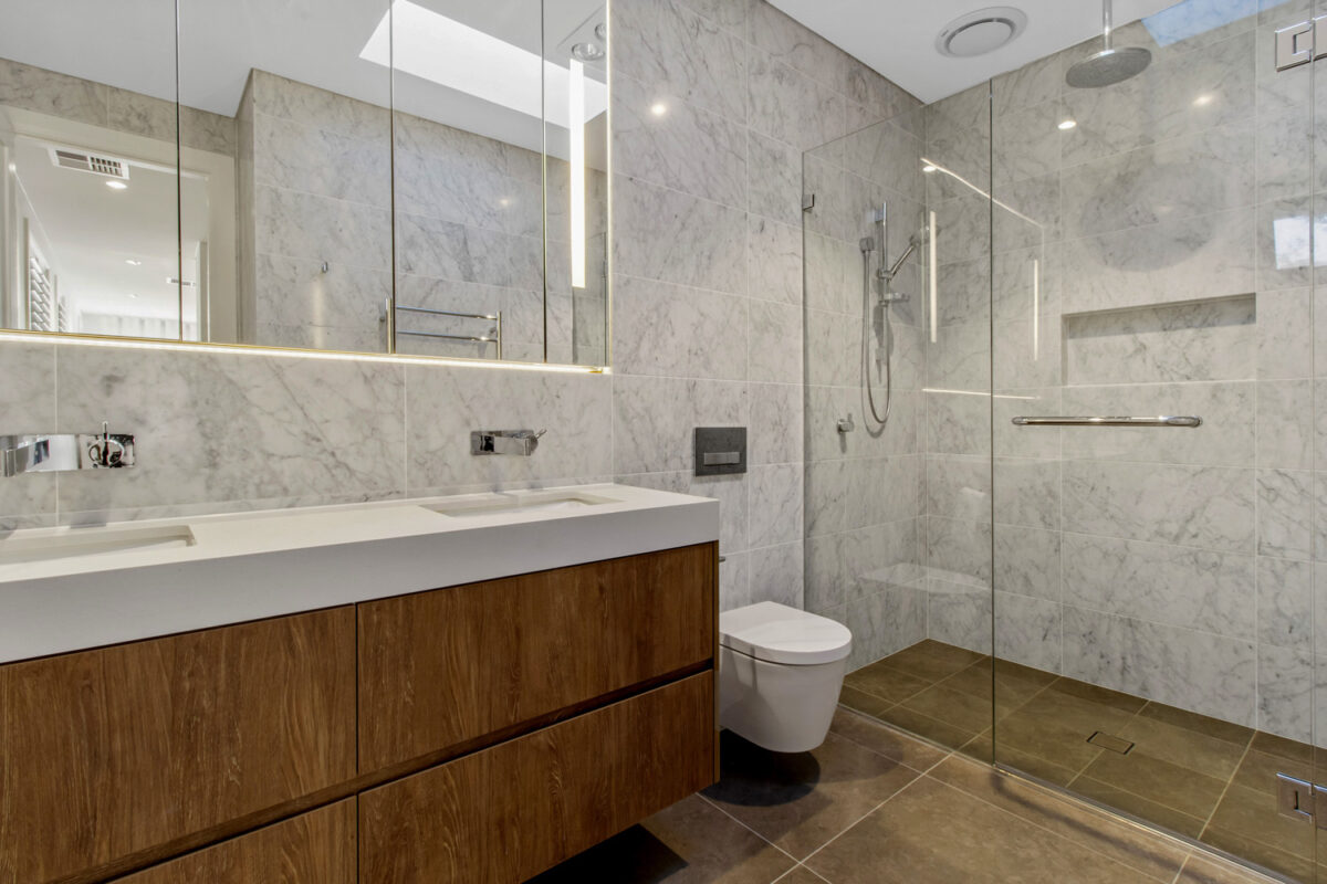 Killara Contemporary: Bathroom with frameless shower and double sink