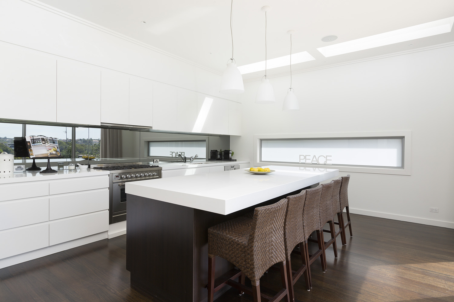 Mosman Contemporary: kitchen area with bar stools at the bench