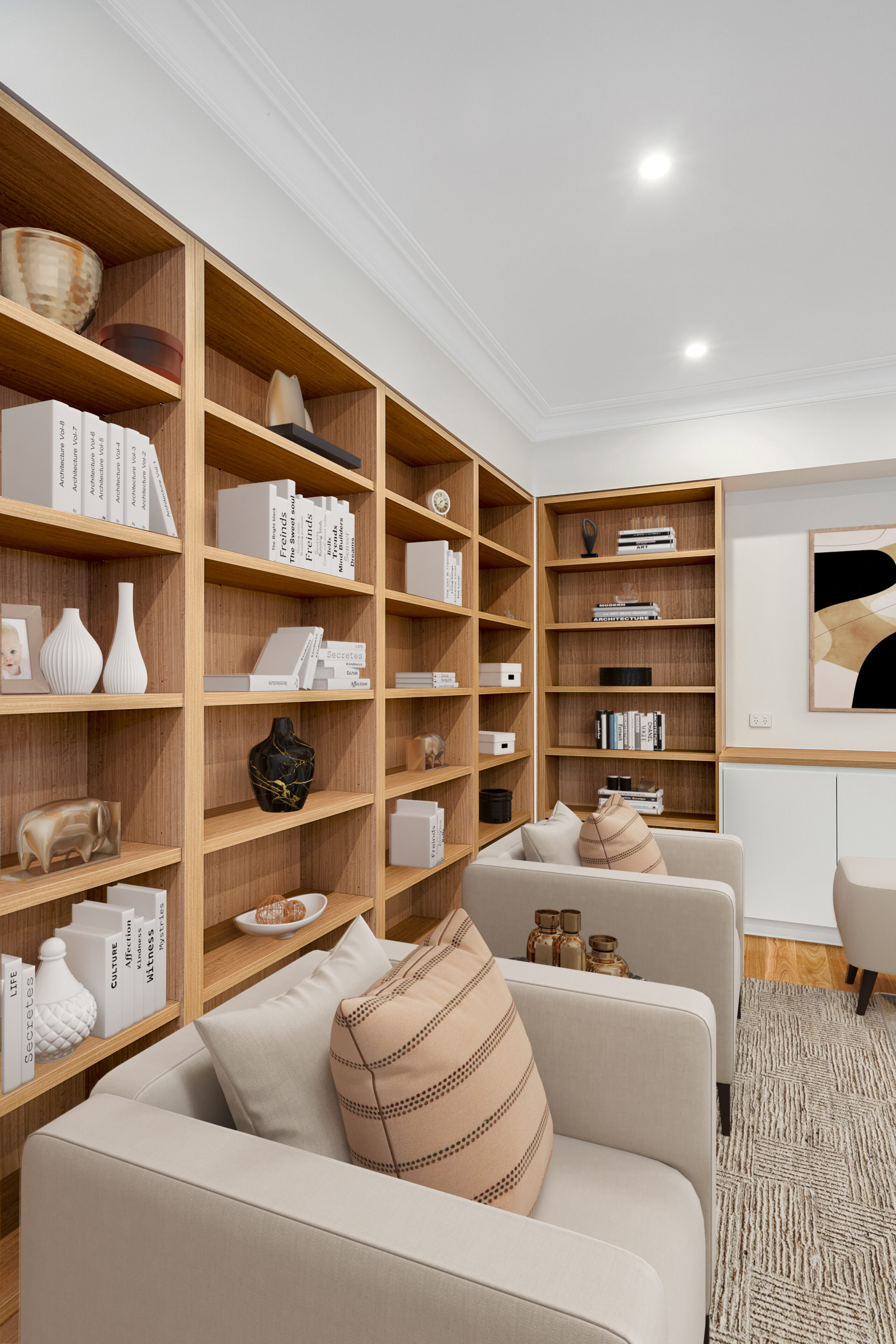Bespoke timber library with upholstered armchairs and tailored display shelving.